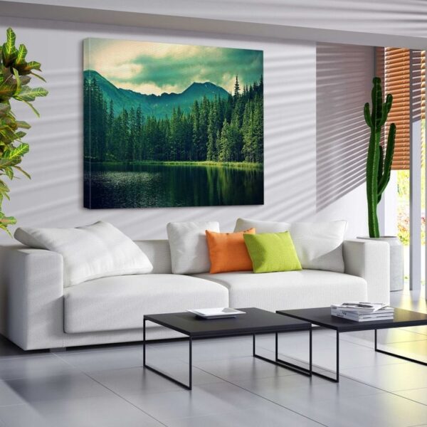 Lush green forest with serene mountain and lake view canvas art