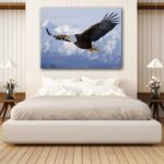 Soaring eagle above snowy mountains canvas print