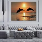 Two Dolphins jumping during Sunset View Canvas Wall Print