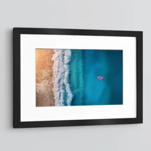 Woman Floating on a Warm Sea Beach